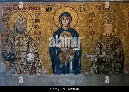 The Comnenus mosaic inside Aya Sofya (the former basilica Hagia Sophia of Constantinople) at Istanbul in Turkey. Virgin Mary is holding Child Christ. Stock Photo