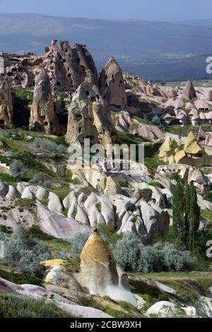 A view of Pigeon Valley showing fairy chimneys and coloured rock formations. Pigeon Valley is located at Uchisar in the Cappadocia region of Turkey. Stock Photo