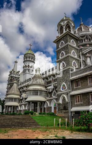 church antique stone bricks made in unique black and white color with bright blue sky image is taken at wayanad india. Stock Photo