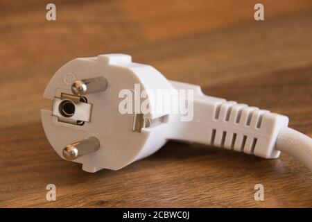 a white european ac plug for electricity Stock Photo