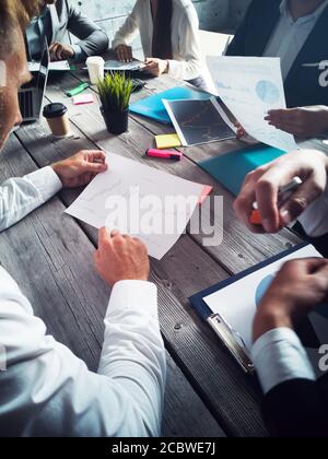 Business people analyzing data diagrams financial reports development strategy Stock Photo