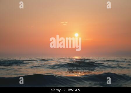 Incredibly beautiful sunset on the beach in Scotland. Sun, sky, sea and waves. Ayr beach, Scotland Stock Photo
