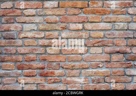 Background from an old and worn red brick wall Stock Photo