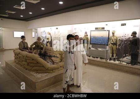 Alamein, Egypt. 10th Aug, 2020. Visitors take selfie in Alamein Military Museum in Alamein, Egypt, Aug. 10, 2020. At Egypt's Mediterranean northern coast, Alamein Military Museum houses weapons, maps, photos and vehicles that bear witness to one of the largest battles during the World War II. TO GO WITH 'Feature: Egyptian museum bears witness to crucial World War II battle' Credit: Ahmed Gomaa/Xinhua/Alamy Live News Stock Photo