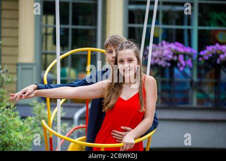young couple having fun in the amusement park Stock Photo