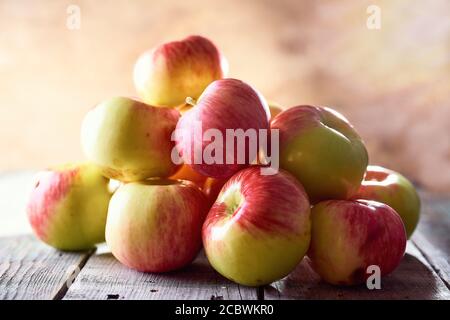 Composition of village red apples on a wooden table Stock Photo