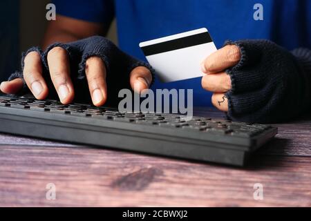 hacker hand stealing data from credit card  Stock Photo