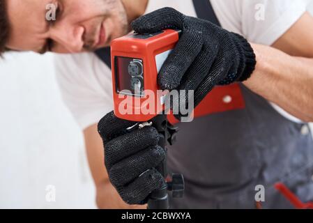 Male worker using laser level. Renovation concept Stock Photo