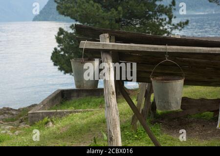 Old, clean aluminum, iron bucket hanging Stock Photo