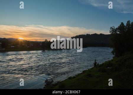 Sunset on a choppy river wind early spring landscape Stock Photo