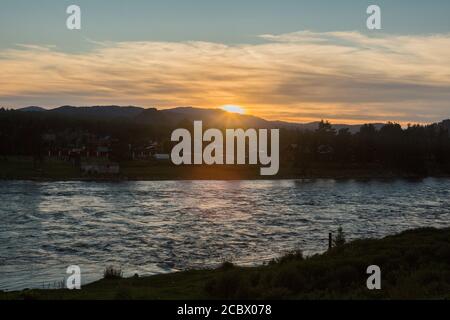 Sunset on a choppy river wind early spring landscape Stock Photo