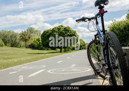 Ivano-Frankivsk, 29 May 2020: mountain bike stands in park on bicycle path. Stock Photo