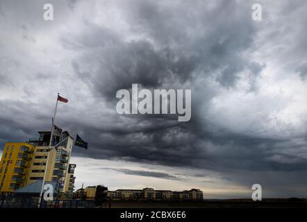Storm clouds over Harbour on South coast of UK Stock Photo