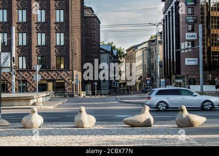 creative concrete road barriers on the street, as well as a cozy bench for tired tourists. Stock Photo