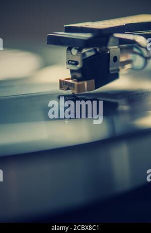 Vinyl album playing on a turntable Stock Photo