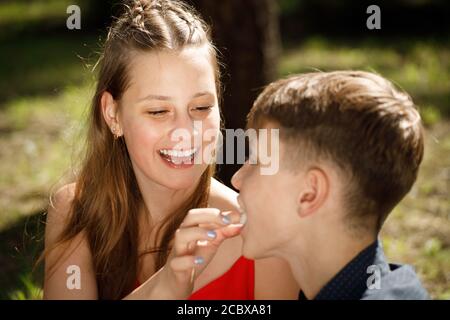 young couple on a romantic date eats cotton candy. Stock Photo