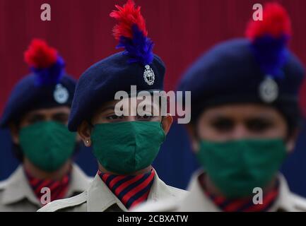 Police and other paramilitary personnel parade during the Independence day celebrations at Assam Rifles ground, Agartala, Tripura, India. Stock Photo