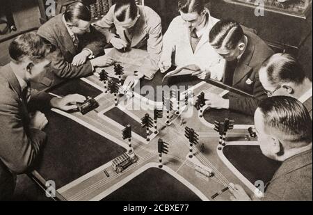 Following increased road accidents in 1934, traffic experts plan the introduction of traffic lights at a London cross roads Stock Photo