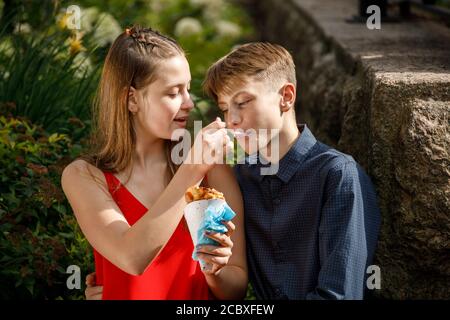 young couple on a romantic date eating ice cream. Stock Photo