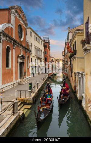 Gondola ride in Venice early in the evening Stock Photo