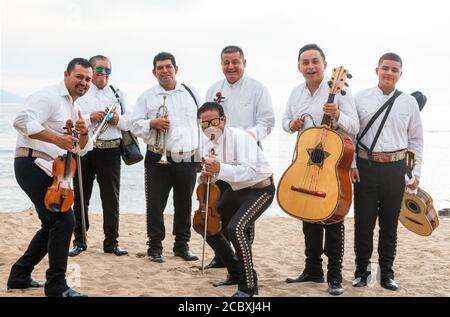 Puerto Vallarta, Jalisco, Mexico - 1308 20 : A Mariachi Band is on The Beach in Puerto Vallarta With Their Instruments Mexico offering Their Service Stock Photo