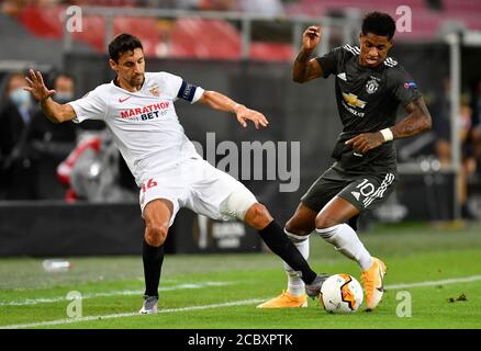 Sevilla's Jesus Navas (left) and Manchester United's Marcus Rashford battle for the ball during the UEFA Europa League Semi Final match at Stadion Koln, Cologne. Stock Photo