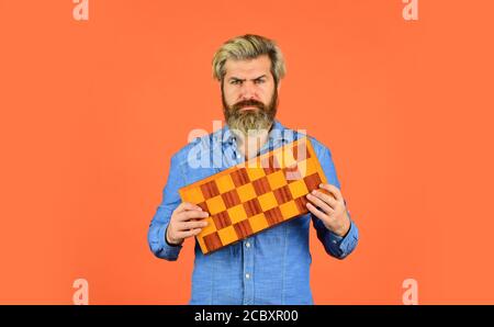 Intelligence level measurement. level up your iq. bearded man hold chess board. intelligence quotient concept. human brain working. brainstorming concept. play chess tournament. Stock Photo