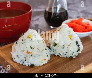 Japanese Homemade Rice Balls Onigiri with Soy, Soup and Pickled Ginger Stock Photo