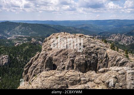 Hikers at the summit of Black Elk Peak, the highest point in South Dakota Stock Photo