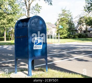 Berks County, Pennsylvania- August 14, 2020: USPS mailbox on suburban street in Pennsylvania Stock Photo