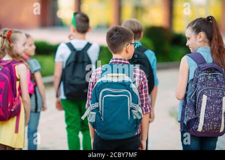 Group of kids going to school together. Stock Photo