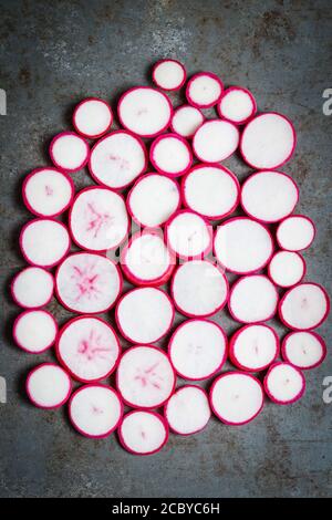 Fresh radishes on a dark surface Stock Photo