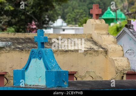 Architecutral detail of colorful burial crypts in the cemetery of Chichicastenango, Guatemala. Stock Photo