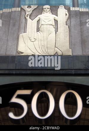 Relief sculptural decoration over the main entrance of the iconic Art Deco building at 500 5th Avenue, architectural detail Stock Photo