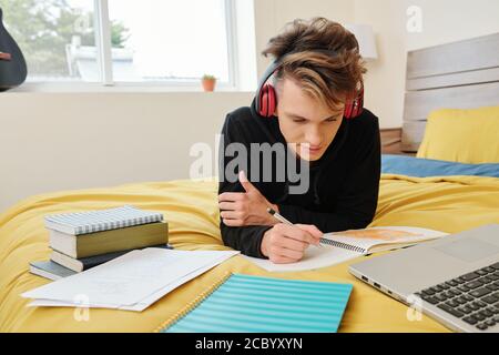 High school student doing homework Stock Photo