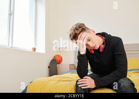 Boy suffering from headache Stock Photo