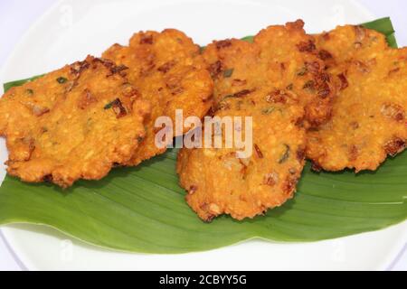 Dal vada or Dal Pakoda or Parippu Vada or Paruppu Vadai , deep fried snacks savory food from south India fried in coconut oil, Tea time snack Stock Photo