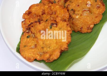 Dal vada or Dal Pakoda or Parippu Vada or Paruppu Vadai , deep fried snacks savory food from south India fried in coconut oil, Tea time snack Stock Photo