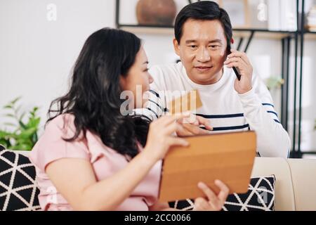 Married couple shopping online Stock Photo
