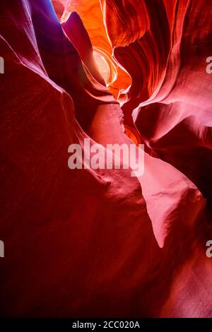 Mysterious Lower Antelope Canyon in Page Arizona with natural landscapes of bright sandstones stacked in flaky fire waves in a narrow sandy labyrinth Stock Photo