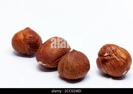salted hazelnuts on white background Stock Photo