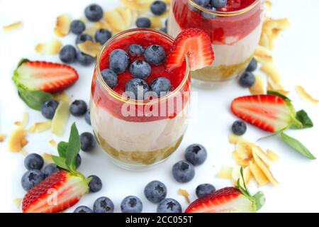 Home made cheese cake with a selection of fruits and strawberry topping. Stock Photo