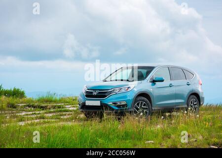 mnt. runa, ukraine - jun 22, 2019: popular family SUV in mountains 