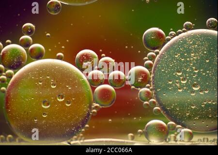 multi-colored drops of oil close-up on a colored background for the background Stock Photo