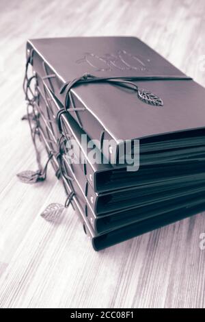 Vintage brown leather photo scrapbook albums.  With colour toning Stock Photo