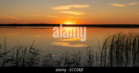 Picturesque sunset over the lake Stock Photo