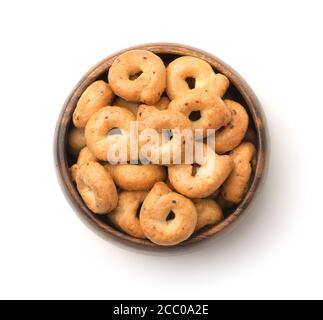 Top view of traditional italian taralli in wooden bowl isolated on white Stock Photo