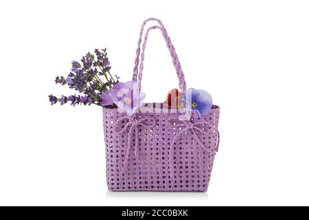 wicker bag with lavender flowers isolated on white background Stock Photo