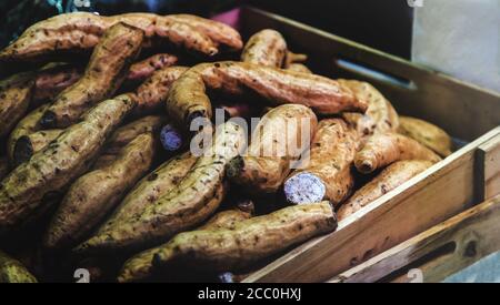 fresh taro root from field on harvest season on wood box Stock Photo