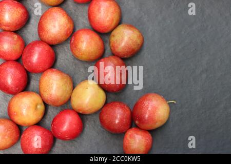 Plum fruits isolated on black background Stock Photo